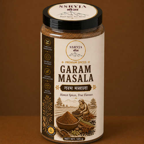 A jar of SSRYJA Garam Masala spice mix on a solid brown background. The jar has a cream-colored label with dark brown text and illustrations of spices, and a black lid with the SSRYJA brand logo.