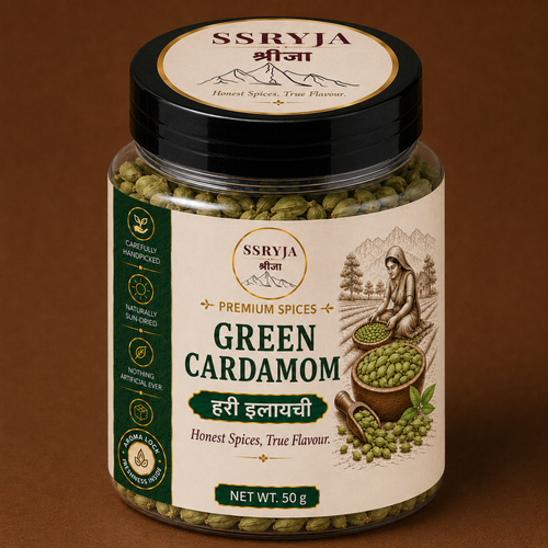 A 50g jar of SSRYJA Green Cardamom (Hari Ilaiyyi) hand-picked green cardamom seeds with a cream and green label and a black lid, set against a solid brown background.