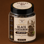 A jar of SSRYJA Black Cardamom spice blend on a solid brown background. The product is in a clear glass jar showing the dark brown spice contents inside, with a beige and black label and a black lid.